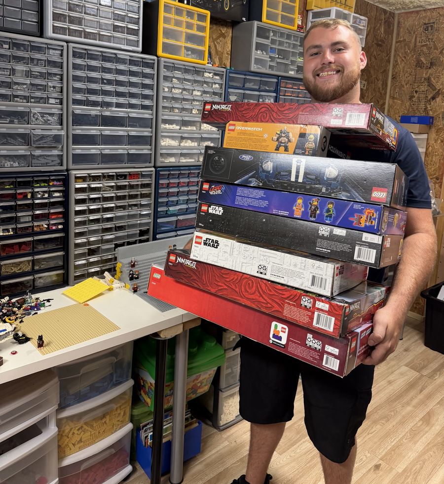 Jackson today holding a stack of new LEGO set boxes